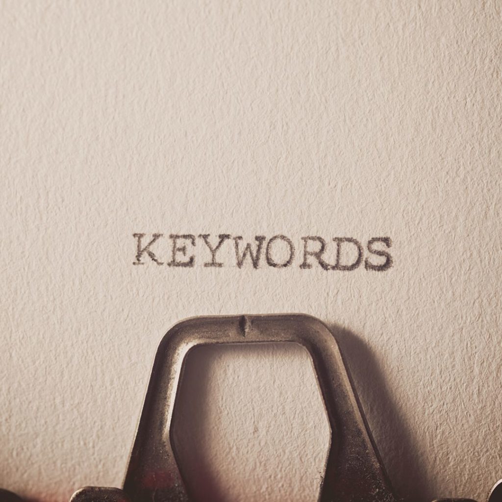 Typewriter close up with the words "Keywords" typed on the paper