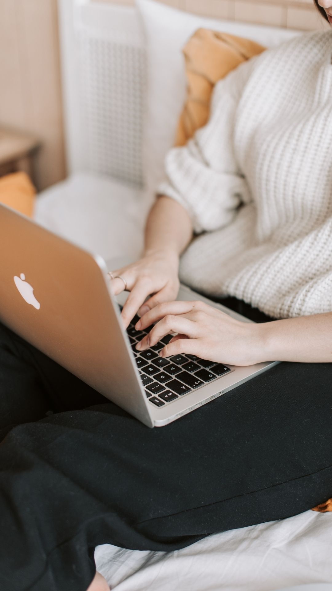 Modern, minimalist workspace featuring a cozy natural aesthetic with a laptop, greenery, and soft lighting. Perfect for showcasing intentional branding design and creative services that resonate with thoughtful, aligned clients.