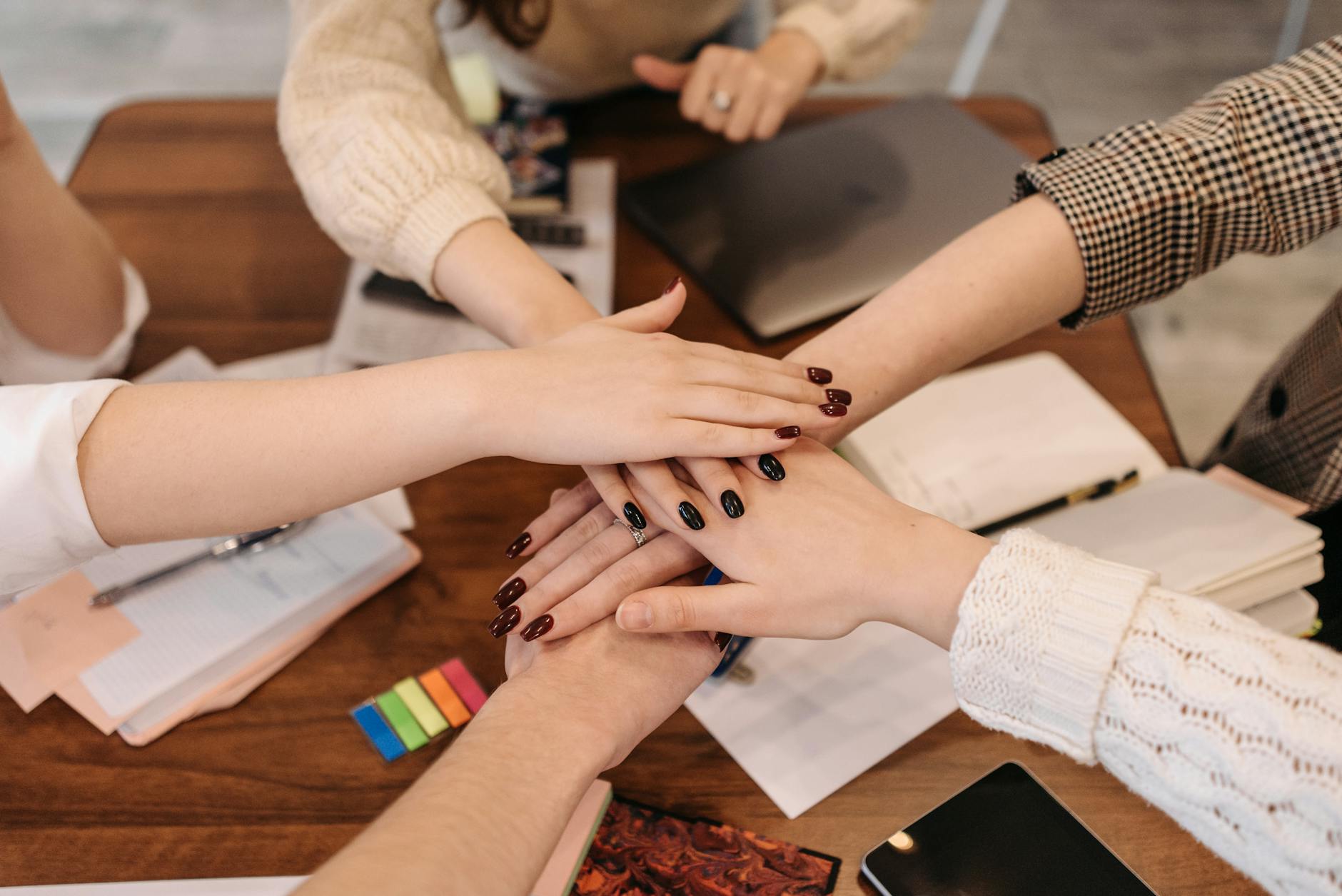 a team of people with their hands together